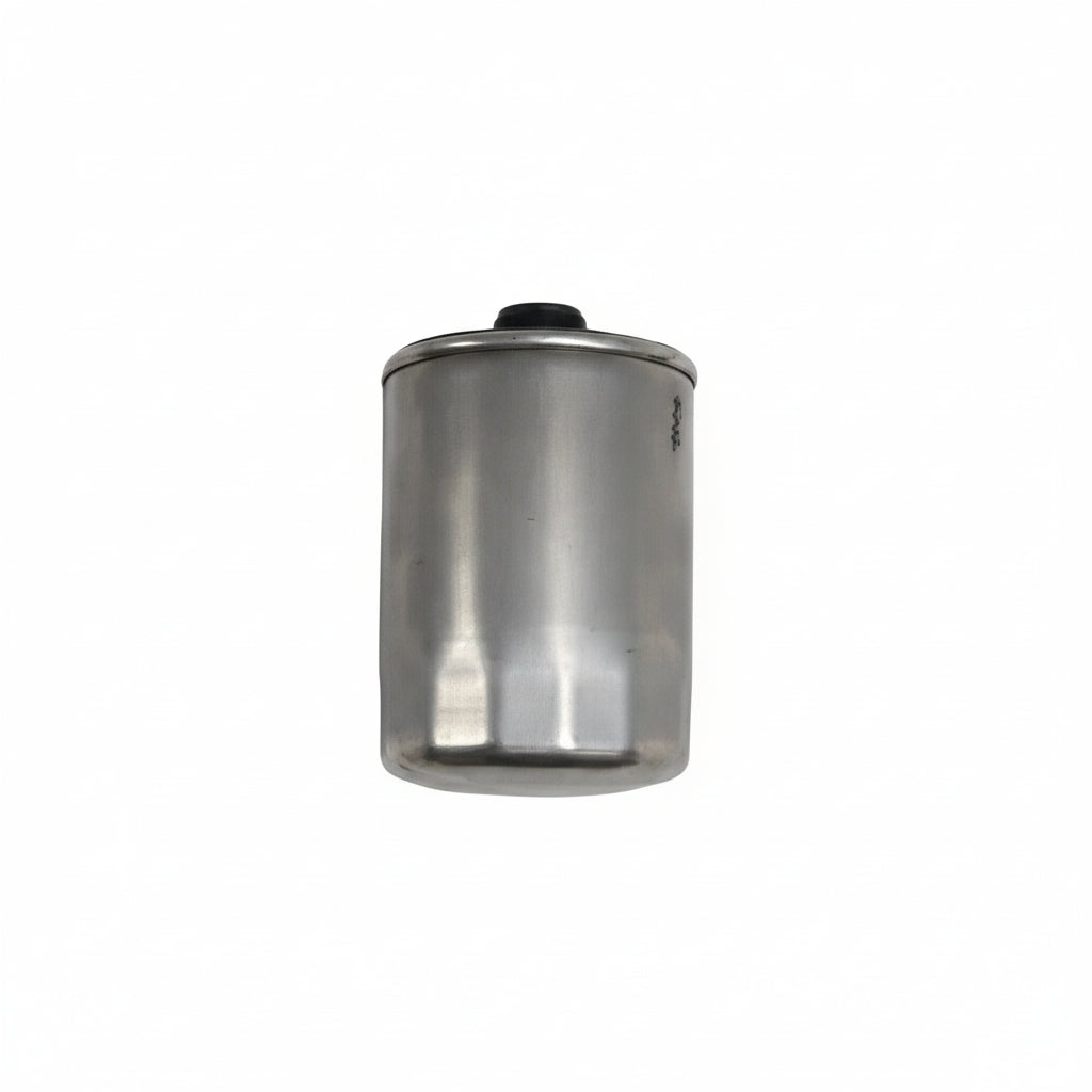 Metallic cylindrical filter on a white background