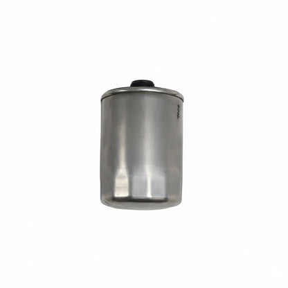 Metallic cylindrical filter on a white background