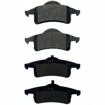 Set of four brake pads on a white background